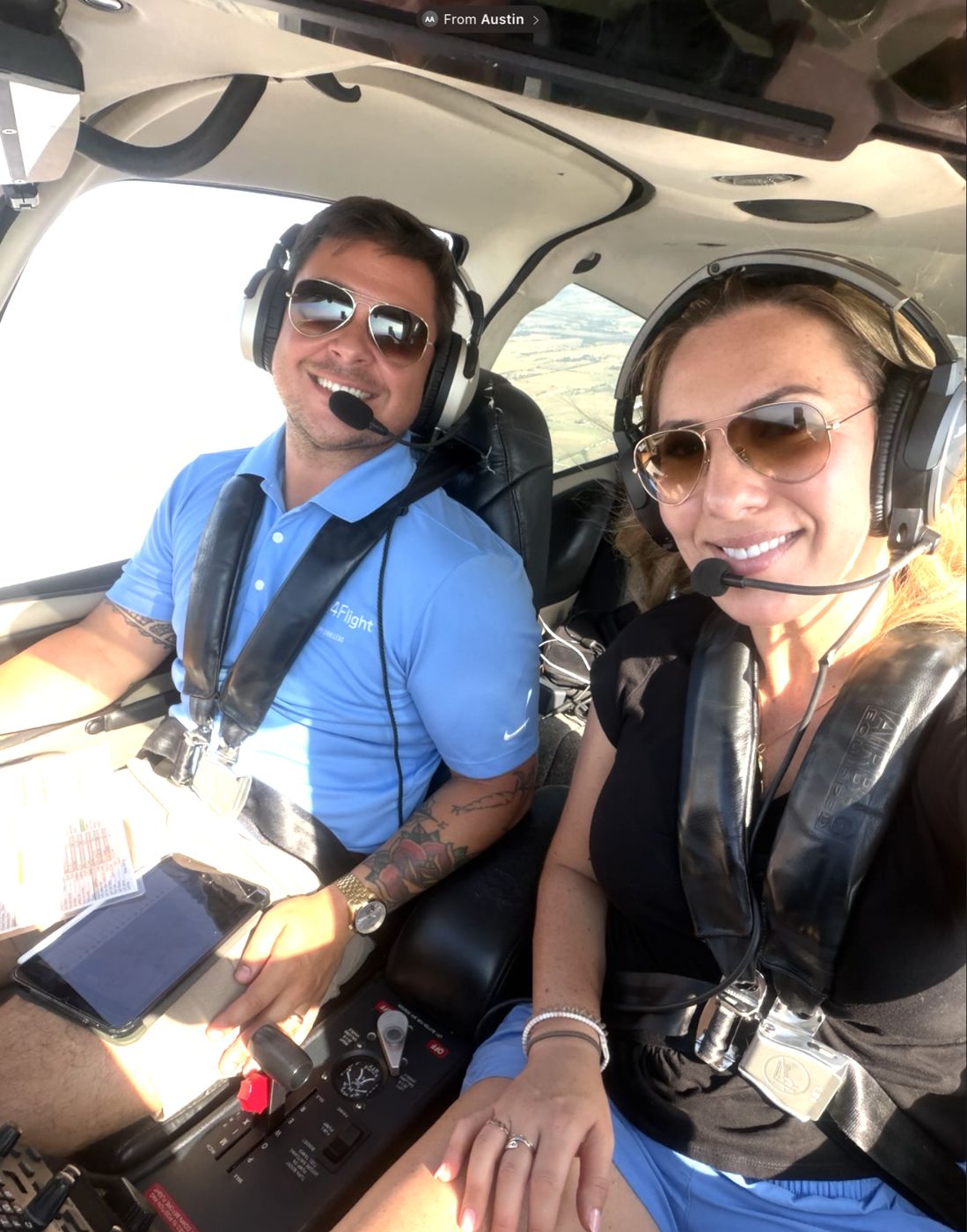 Two people in the cockpit of a Cirrus SR20
