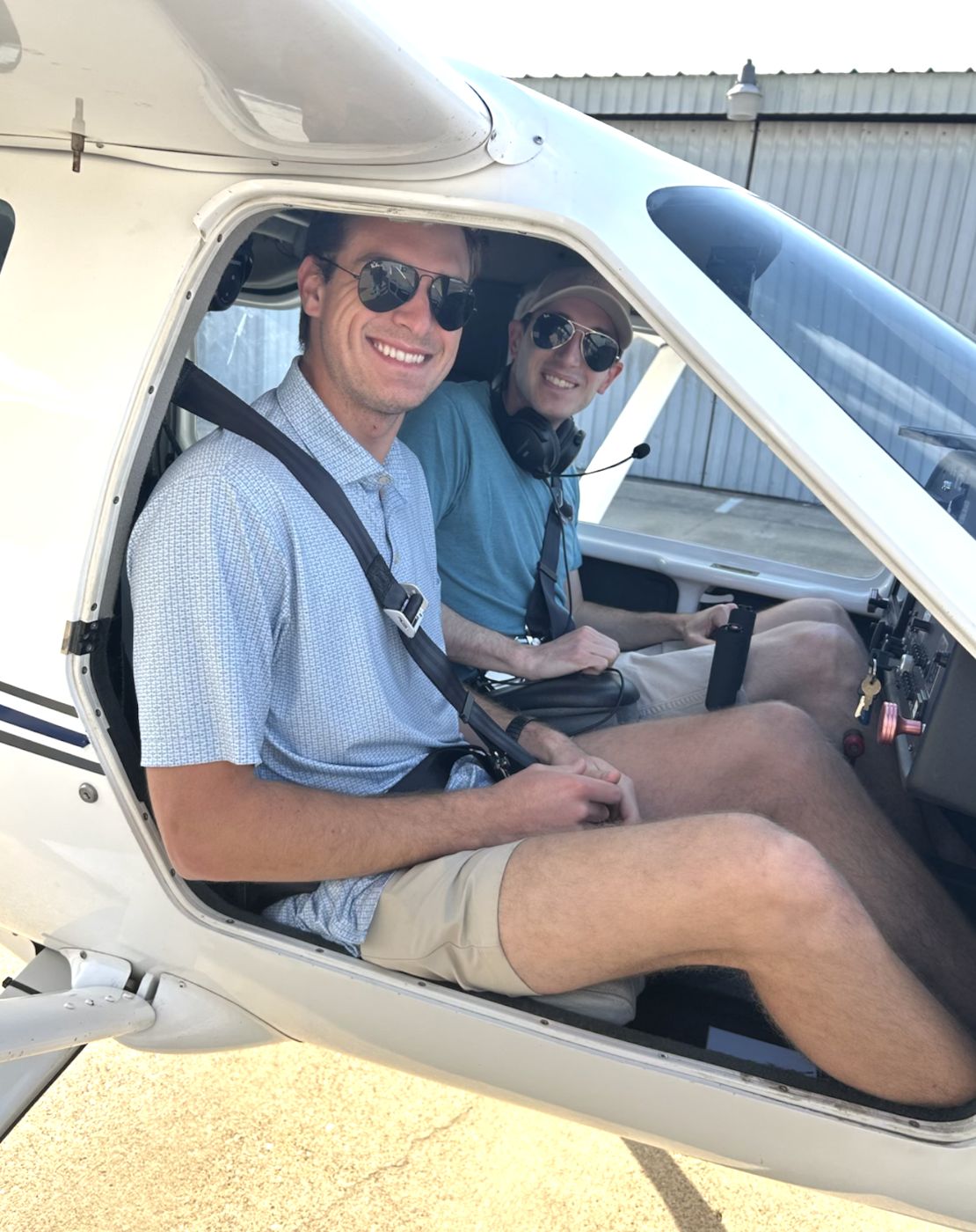 Two people in the cockpit of a Jabiru light-sport aircraft