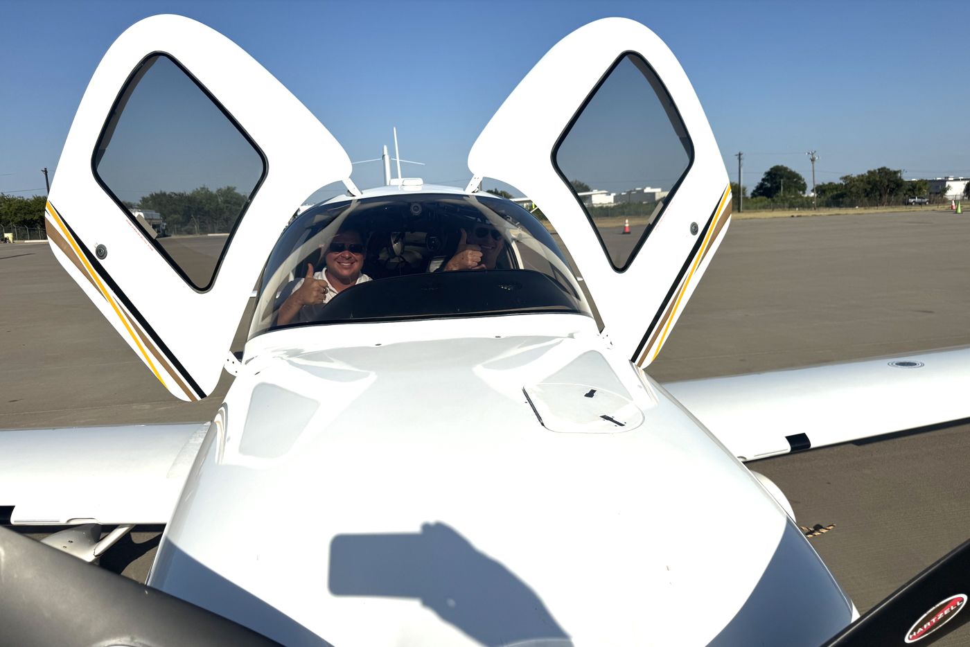Cirrus SR20 with both cabin doors open on the ramp