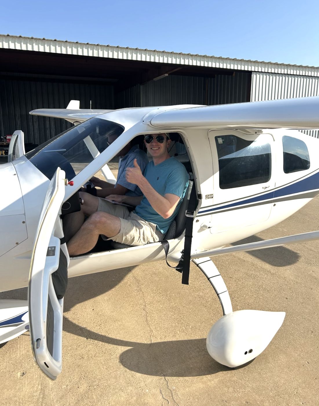 Pilot giving a thumbs-up from the Jabiru cockpit