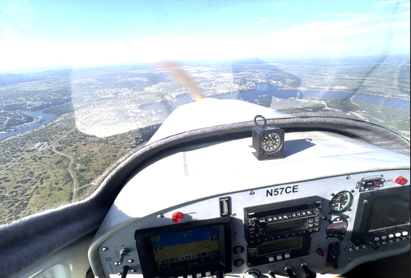 Glass display and steam gauges in the cockpit of Jabiru N57CE in flight